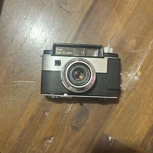 3 cameras( 1 silhouette zoom, 1 Ansco 1065, and 1 signet 30) with an extra lens